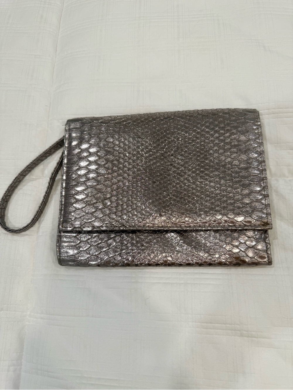 Neiman Marcus clutch purse with wrist strap. Silver faux snake skin.